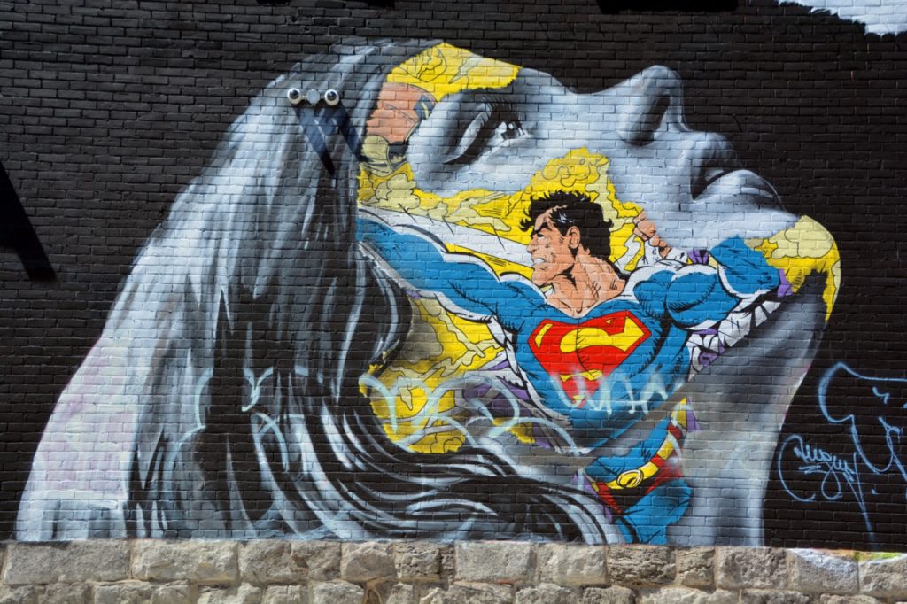 wall painting showing superman and a women
