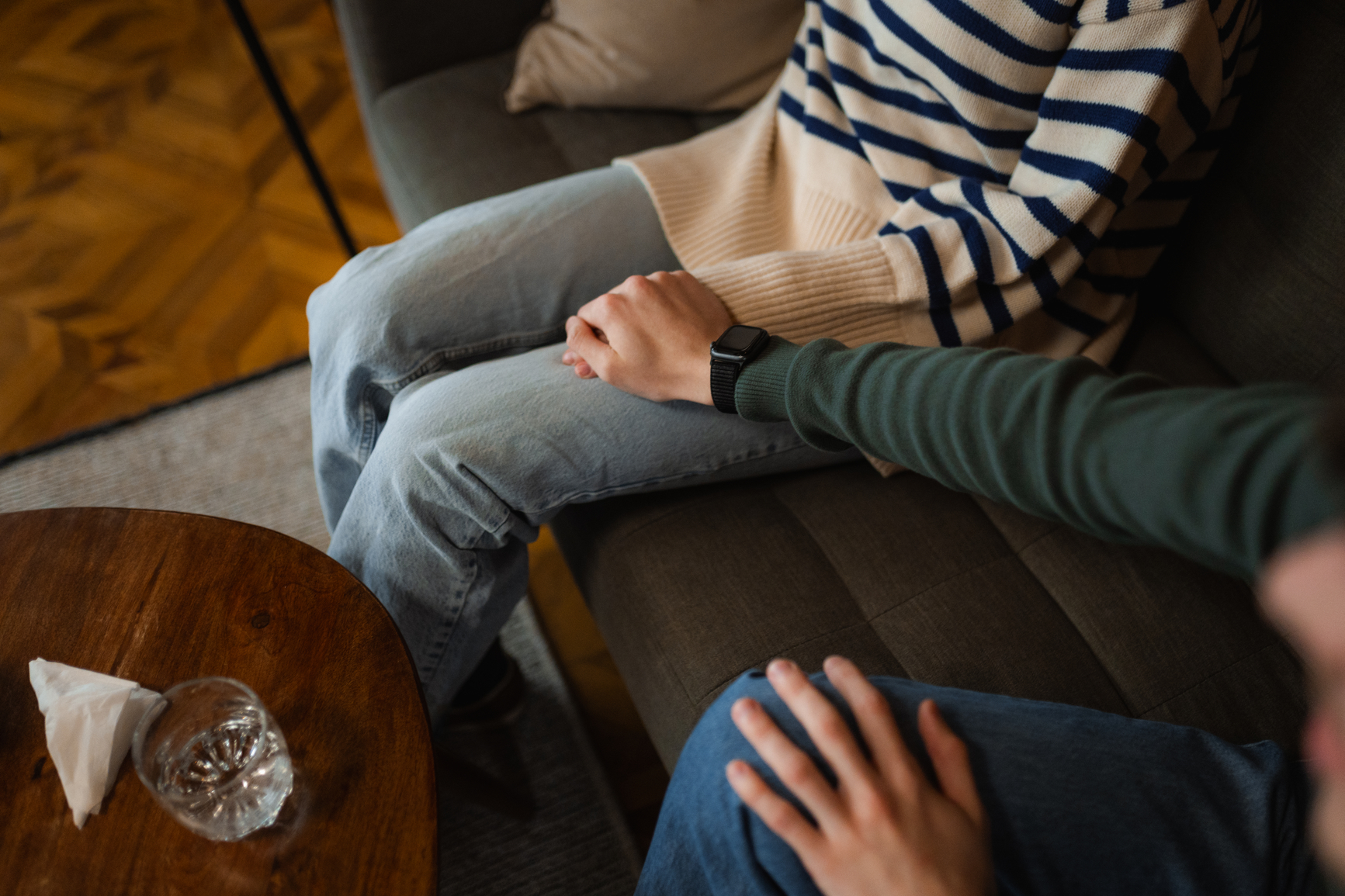 Couple with arms around each other looking toward the future with hope and unity